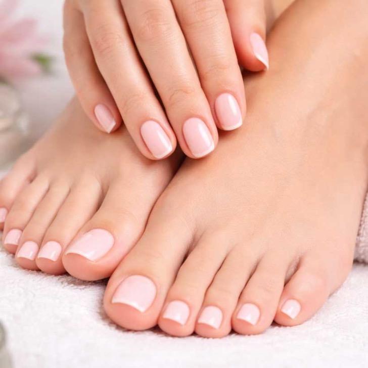 Matching soft pink French manicure and pedicure