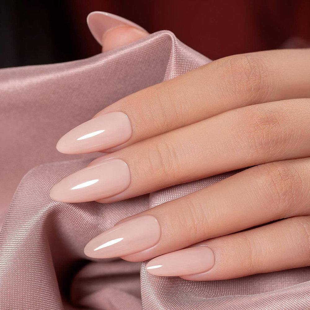 Glossy nude almond extensions on satin